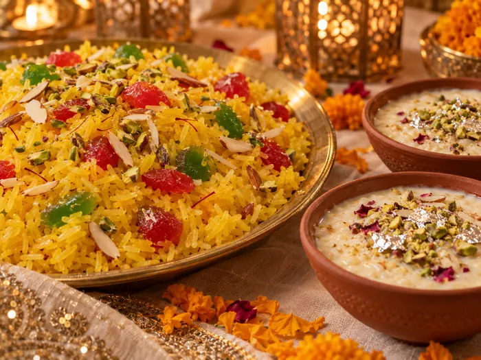 Zarda with almonds and kheer in clay bowls